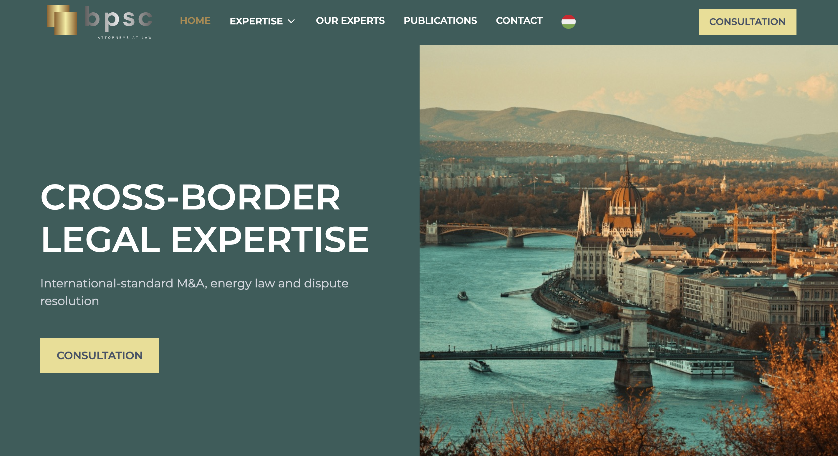 View of Budapest cityscape with the Parliament building and bridges over the Danube River at sunset.